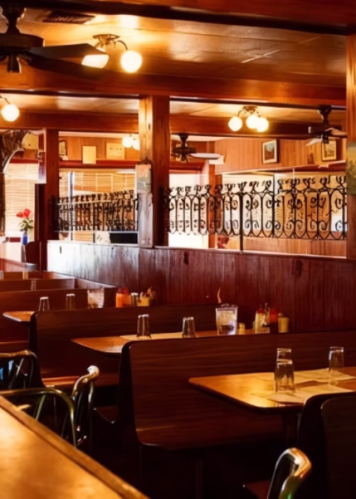 Cozy restaurant dining room with wooden furniture